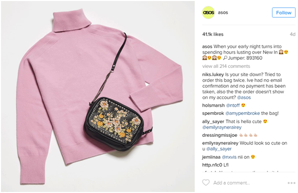 Asos-flat-lay-instagram-post-of-pink-sweater-and-embroidered-clutch