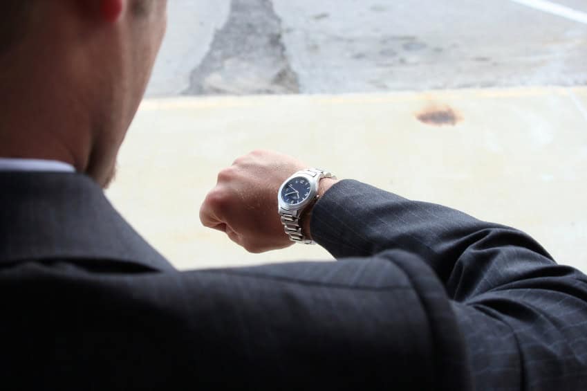 businessman-in-suit-looking-at-watch