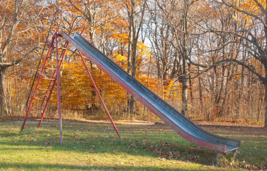 old-slide-in-park-with-autumn-trees old-slide-in-park-with-autumn-trees