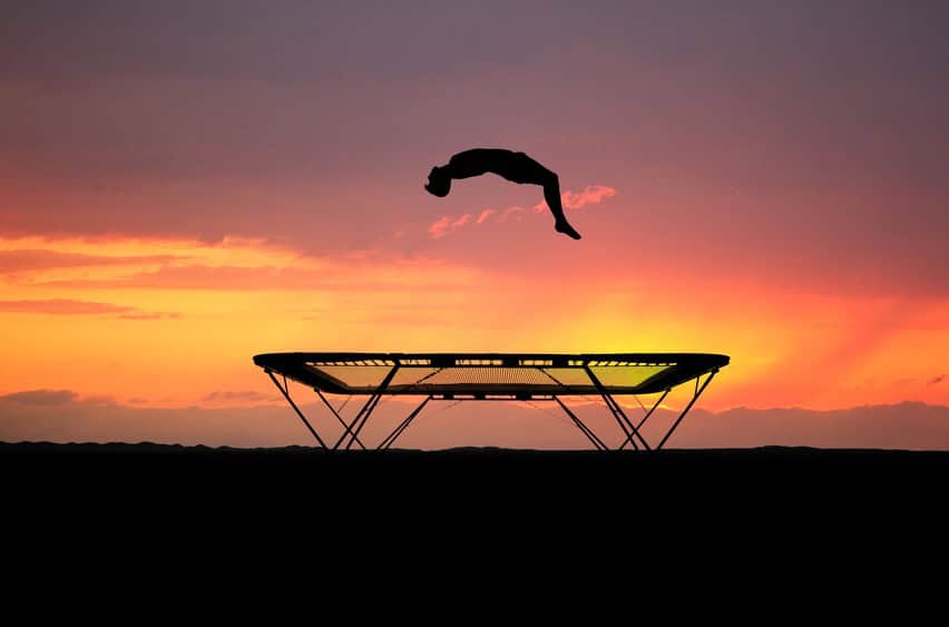 back-flip-on-trampoline-in-sunset back-flip-on-trampoline-in-sunset
